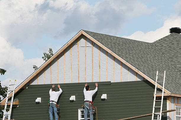 Professional Siding Installation technician working in South Mills, NC